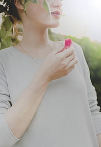 Woman Holding Sliced Fruit thumbnail