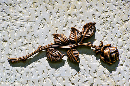 brass rose on concrete surface thumbnail
