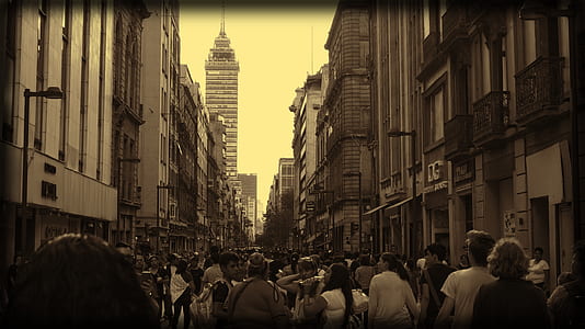 people on the street in between buildings thumbnail