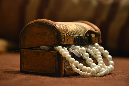 white pearl necklace in brown wooden dome chest thumbnail