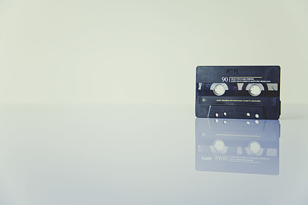 black cassette tape on top of white surface thumbnail