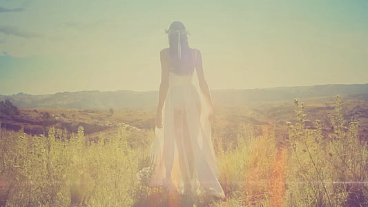 woman wearing white dress on grass field thumbnail
