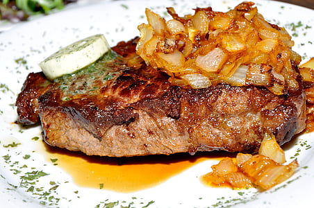 deep fried meat under of fried slice onions thumbnail
