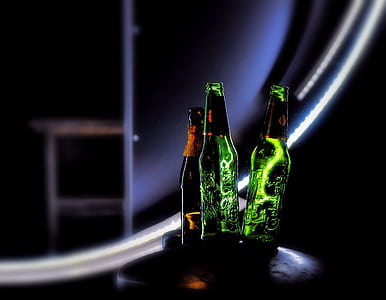 three green and brown glass bottles thumbnail