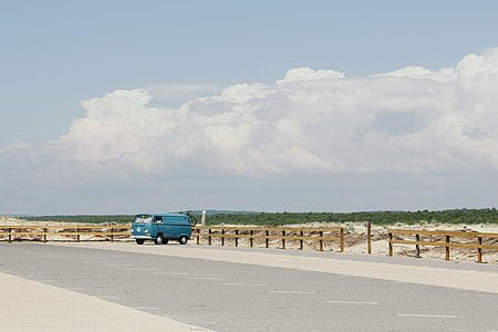 blue van parking near road thumbnail