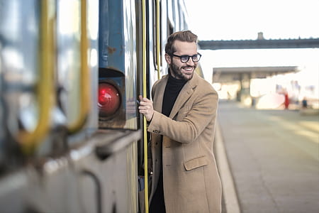 man holding stepping inside train thumbnail