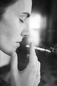 person holding cigarette smoking thumbnail