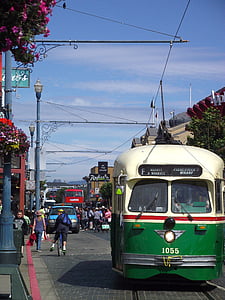 white and green tram on road thumbnail