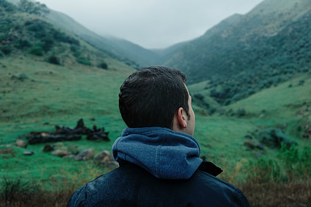man looking sideways on mountains thumbnail