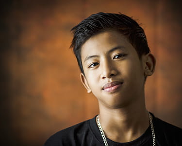 Close-Up Photography of a Boy Smiling thumbnail