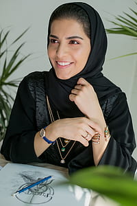 woman smiling in front of desk thumbnail