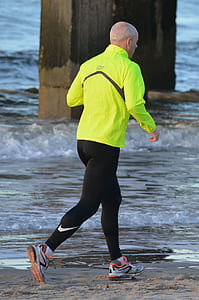 running man wearing yellow top and black leggings thumbnail