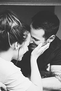 woman touch face of man in-front of him thumbnail