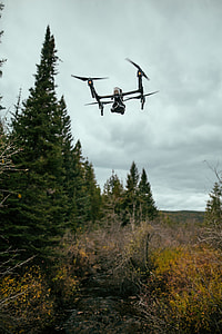 white and grey quadcopter drone on flight thumbnail