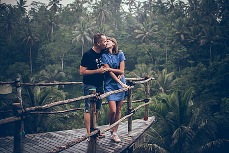 Man Kissing Woman on Cliff thumbnail