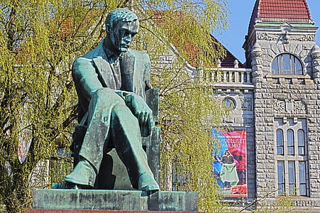 concrete statue near the tree thumbnail
