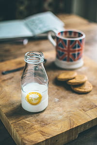 Milk bottle on brown wooden board thumbnail