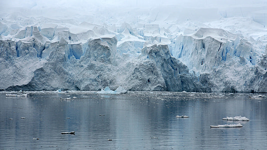 iceberg near body of water at daytime thumbnail