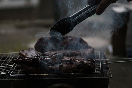 person grilling meat thumbnail