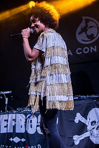 woman singing on stage thumbnail