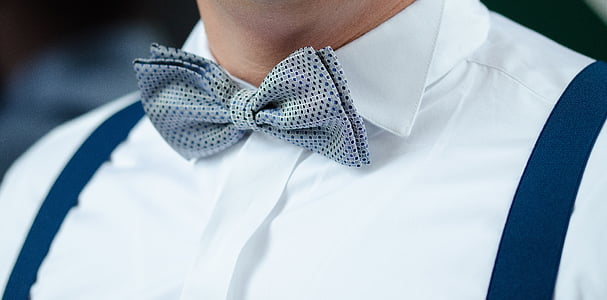man in grey and black bow tie thumbnail