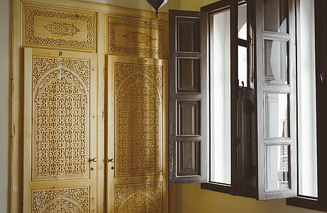gray wooden framed glass window opened near brown wooden doors inside room thumbnail