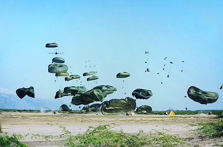 gray parachutes hanging on sky thumbnail