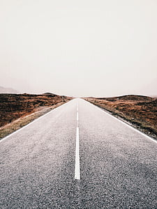 gray road under white sky thumbnail