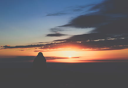 person standing during sunset thumbnail