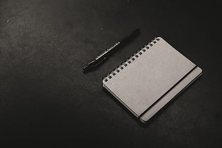white notebook with pen on floor thumbnail