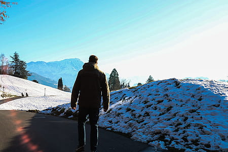 man walking near snow surface thumbnail