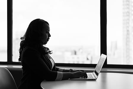 Grayscale Photography of Woman Using Laptop thumbnail