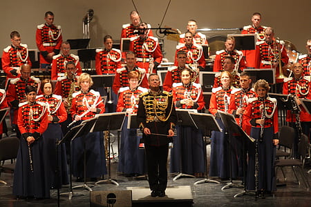 group of people holding music instruments on stage thumbnail