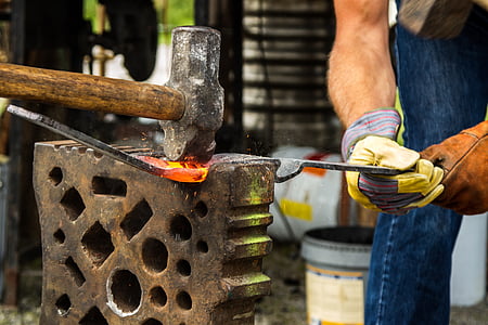 man holding forging iron thumbnail