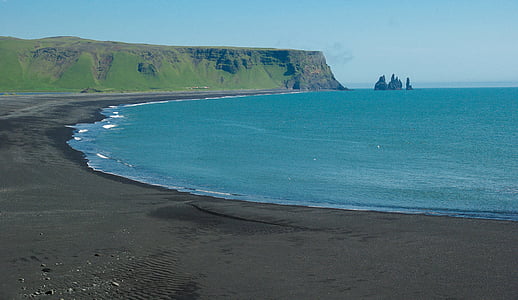photo of body of water near promontory thumbnail