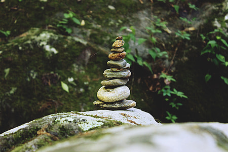 gray cairn stones on rock closeup photography thumbnail