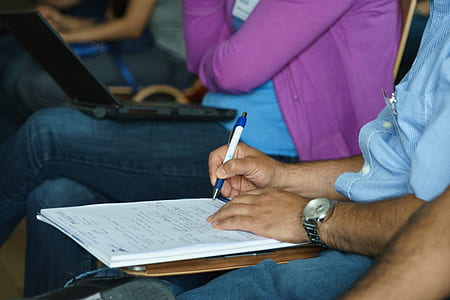 man sitting about to write on paper thumbnail