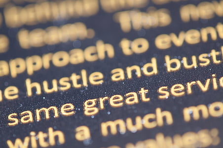 closeup photo of white text on blue cloth thumbnail