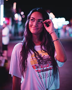 woman looking up holding her eyeglasses thumbnail