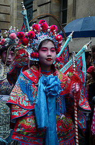 woman wearing red and blue traditional dress thumbnail