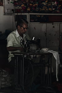 man using sewing machine thumbnail