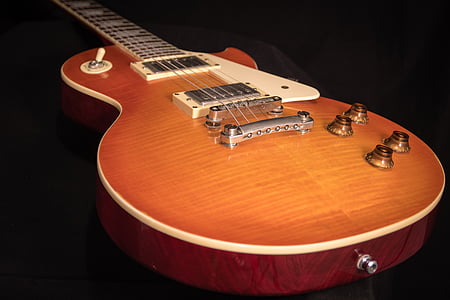 brown single-cutaway acoustic guitar thumbnail