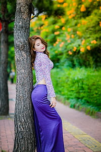 Woman Standing And Leaning On Tree thumbnail
