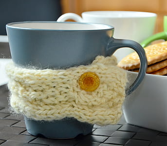 yellow knitted stubby holder wrapped around grey mug thumbnail