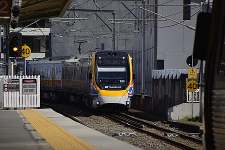 yellow and black train on rail thumbnail