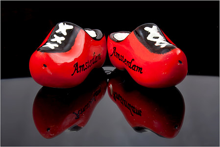 pair of red and black ceramic shoe decors thumbnail
