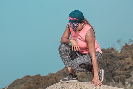 Woman Sitting on Rock thumbnail