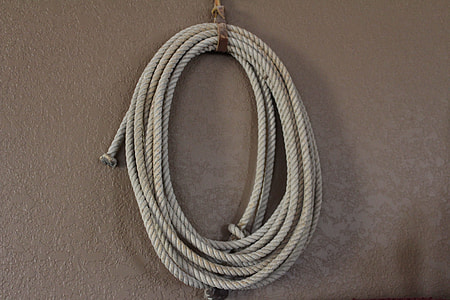 bundle of gray rope on beige surface thumbnail