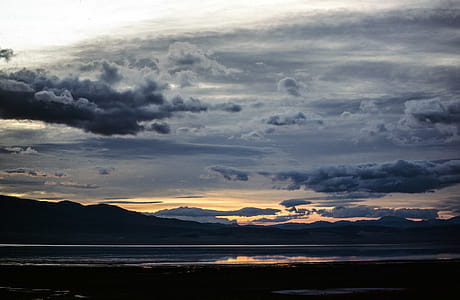 View of sunset clouds over an ocean thumbnail