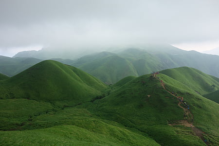 green hills under nimbus clouds thumbnail